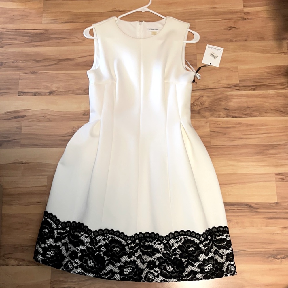Brand New Calvin Klein White dress with black lace trimming